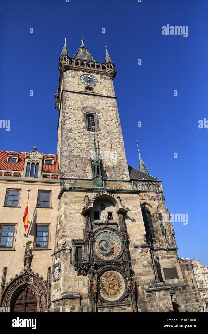 A view of Prague`s Astronomical Clock standing tall and proud in the height of summer with a beautiful blue sky in the background. Stock Photo